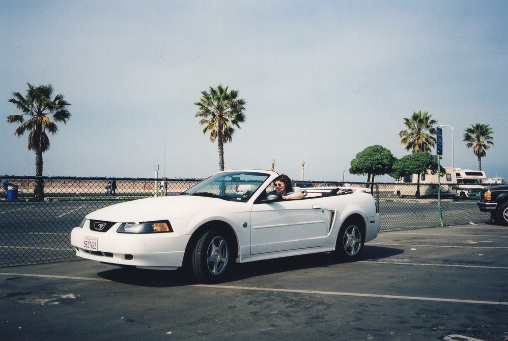 Karen in a white Mustang at Santa Monica Beach